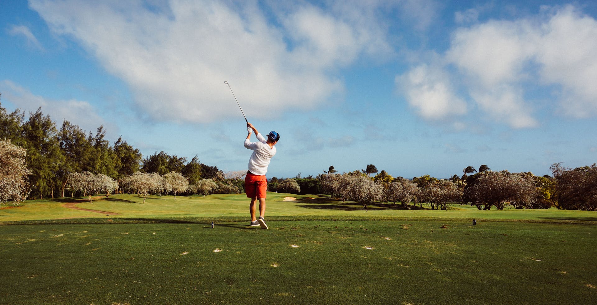 Person hitting a golf ball