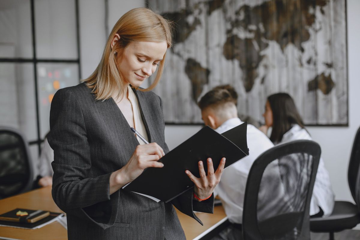 woman in office taking notes