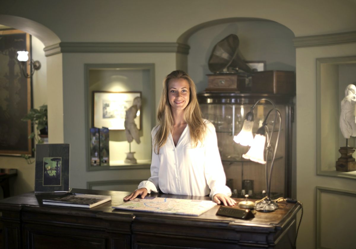 woman standing behind desk